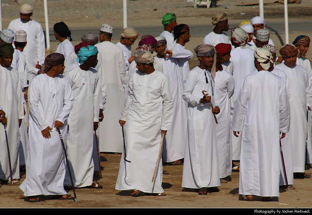 Local men gathering at a square, Sur, Oman