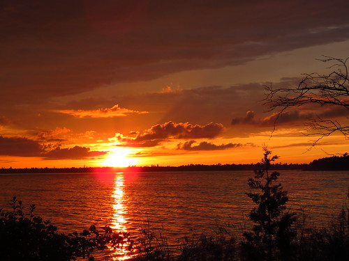 sunset sun sky wisconsin winter nature doorcounty baileysharbor trees orange clouds moonlightbay lakemichigan