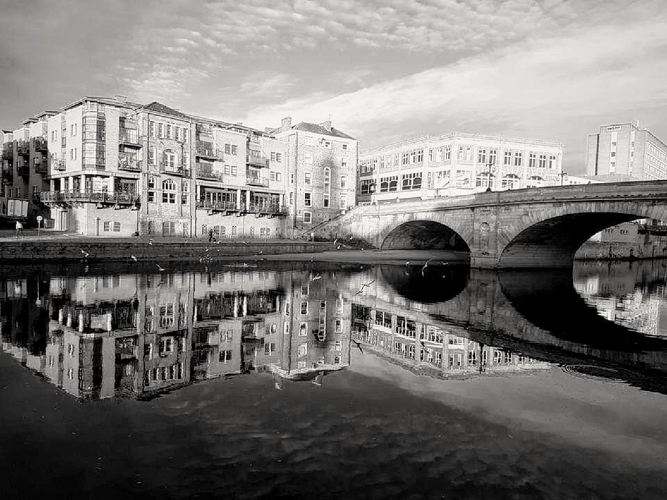 The River Ouse, York, showing reflections of Ouse Bridge and Queen's Staith