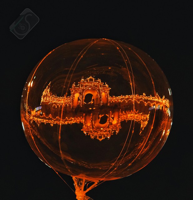 Endless glory, pride and artistic intelligence in this balloon and so called life.  Image is captured in Mysuru , India It is a reflection of  Mysore palace seen on a transparent balloon..
