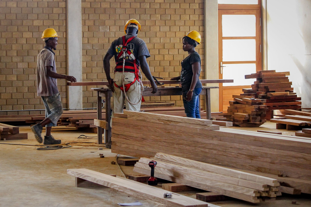 Local workers finish the last details of the new building at the Faculty of Science of the University of Kisangani.