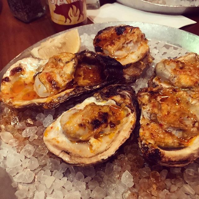 #kvpnola Wood-fired oysters at @cochon_nola. Topped with chili garlic butter. NOM! #kvpinmybelly #oysters