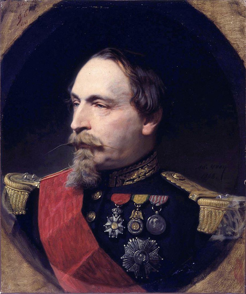 Yvon Adolphe - Portrait of Napoleon III in traditional attire. Moreover, he has a long, skinny beard and pal white skin. 