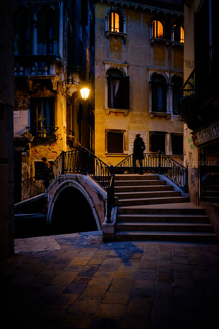 The streets and bridges of Venice in the evening.