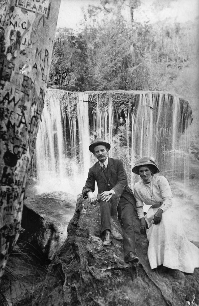 Couple posing by a waterfall in the Rathdowney area Queensland