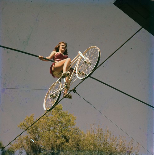 Carla Wallenda rides a bicycle on a high wire