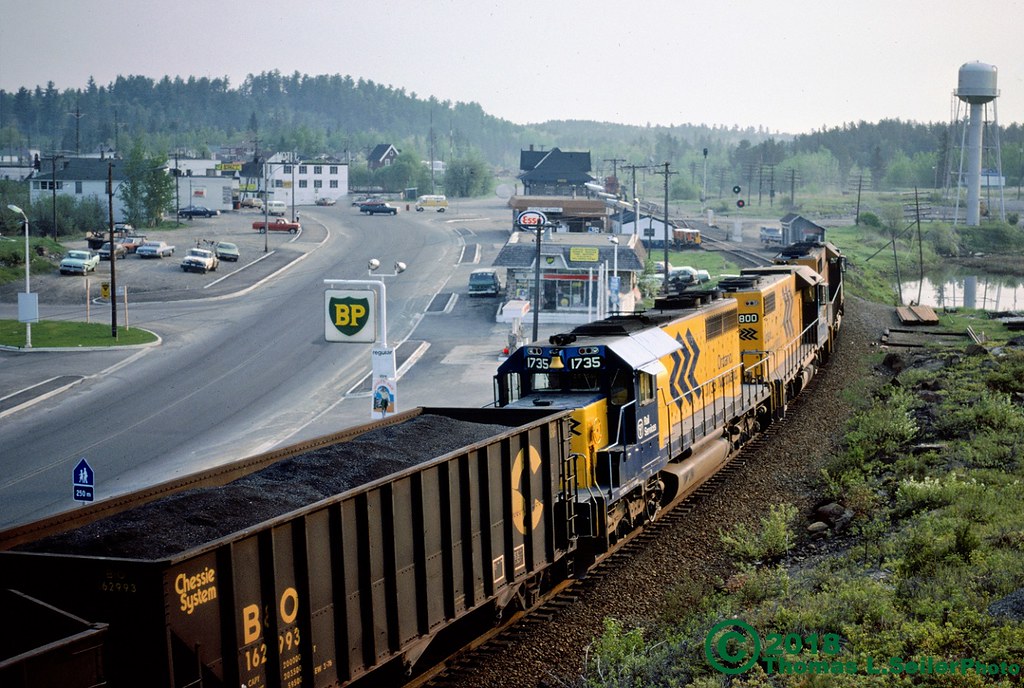 ONTARIO NORTHLAND TRAIN #113 ROLLS THROUGH THE TOWN HEADED NORTH - TEMAGAMI, ONTARIO - MAY 24, 1980