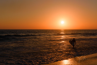 Surfer-enjoying-sunset-on-the-beach.jpg
