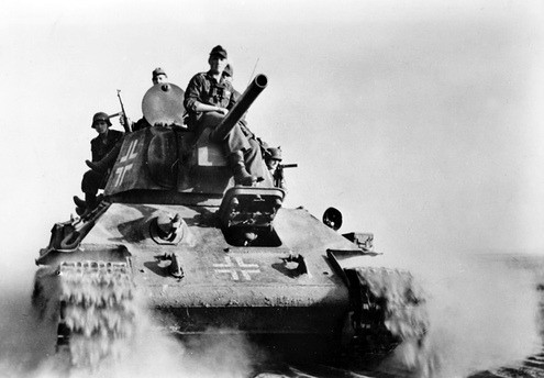 Members of the Freiwilligen-Bataillon “Narwa”, (Estonian battalion Narva)    on a captured T-34 tank on the eastern front at the Dnieper  in November 1943.