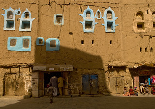 Shops In An Adobe Building With Blue Painted Windows, Amran, Yemen | by Eric Lafforgue