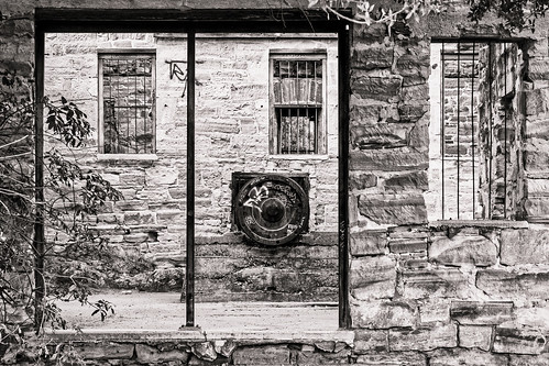 bars block door grafitti industial knightsferry machinery mechanical metal old rusted rustic turbine wall window