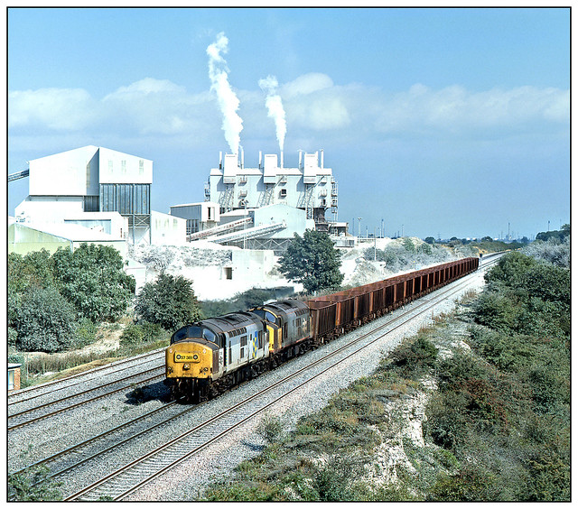 37 381, 37 377 head a Santon bound iron ore train through Melton Ross.
