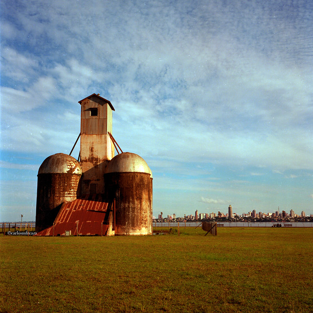 Old silo in Encarnación, Paraguay and Posadas city (Argentina) in the background