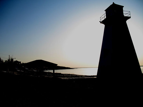 Dans l'ombre du phare by Le Tire-bouchon, sunset sea mer lighthouse soleil 2006 newbrunswick nouveaubrunswick avril phare acadie caraquet