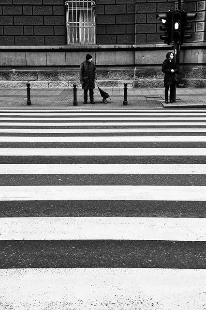 Waiting to cross the road