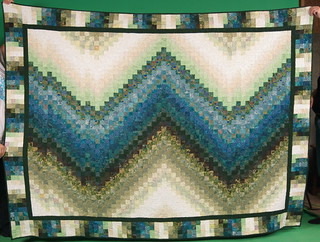 I never got a shot of the bargello quilt, once it was finished. Asai was kind enough to bring it to Thanksgiving, so we could shoot a straight-on photograph.

The story of this quilt: domesticat.net/quilts/lights-over-lothlorien
