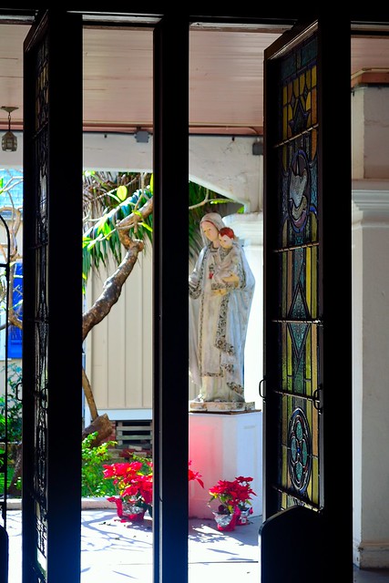 Madonna through louvered stained glass