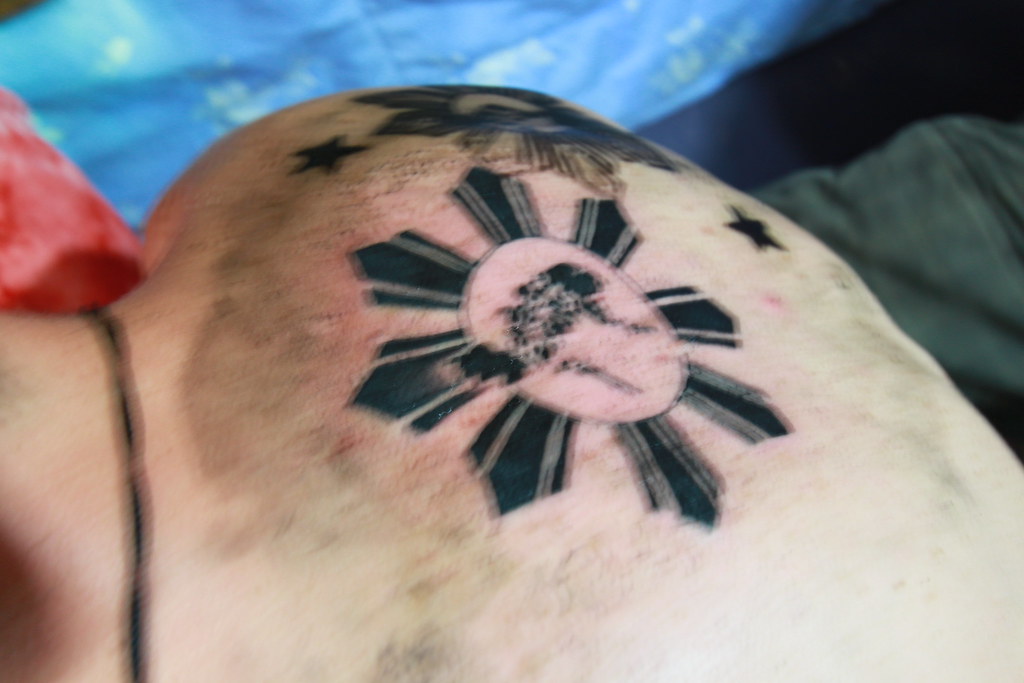Filipino sun and stars with Japanese inspired clouds  cherry blossoms By  Matt Duffenbach Wintership Tattoo Eau Claire WI  rtattoos