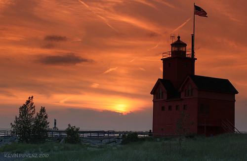 park sunset sky orange sun lighthouse holland color beach silhouette outdoor flag scenic lakemichigan greatlakes westmichigan canont1i