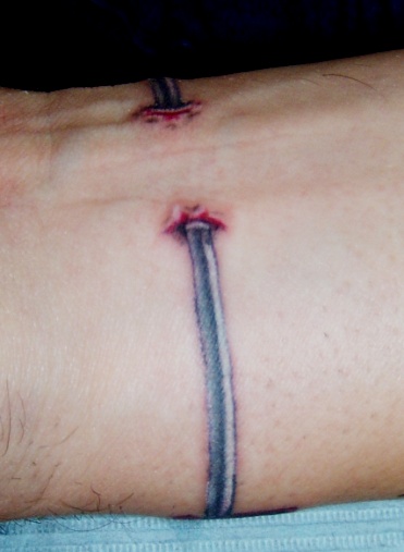 FDNY wrist tattoo with flat line rhythm strip.