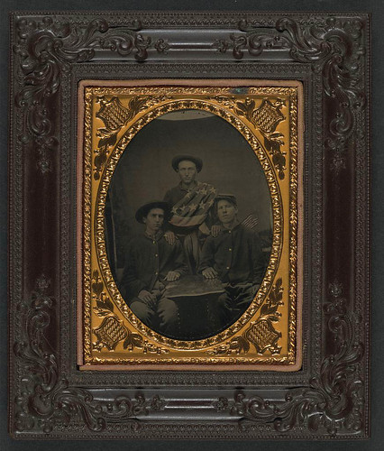 [Three unidentified soldiers in front of painted backdrop showing 34-star American flag] (LOC) | by The Library of Congress