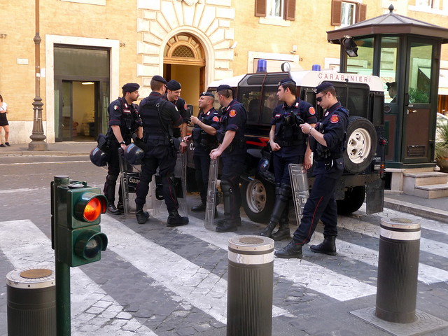 Carabinieri in a huddle, Rome, Italy