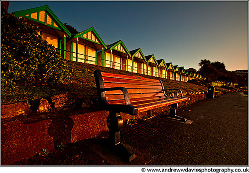 light beach southwales sunrise bench huts promenade gower canonefs1022mmf3545usm langlandbay coastuk canoneos7d andrewwilliamdavies