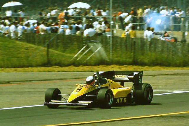 Manfred Winklehock - ATS D6 exits the pits during practice for the 1983 British Grand Prix, Silverstone