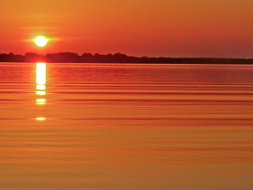African Sunset by CharlieBlewett, Tranquil sunset on one of Rufiji River's many lakes in Selous game reserve Tanzaniaafrica sunset red