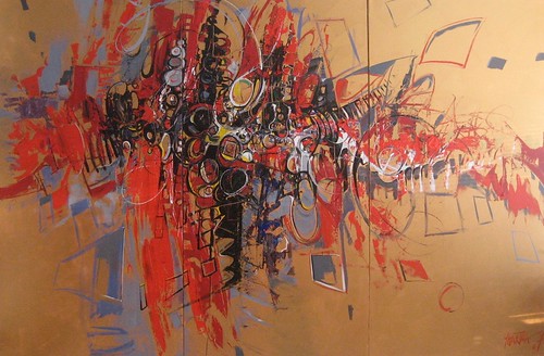 Fine outlined faces with red strokes on ochre