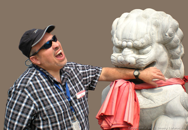 Chris with Guardian Lion Statue