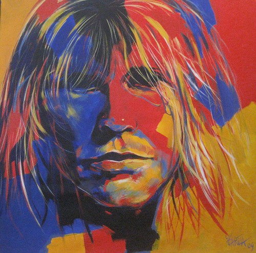 Long-haired musician portrait in blue and orange