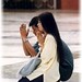 Boy and Girl Praying at Chinese Temple