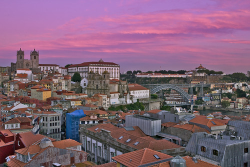 city porto portugal birdseye color sunset pink clouds sky buildings historic downtown river bridge landscape cityscape light
