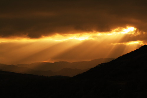 Overcast Sunset by brickxbronson, sunset orange sun mountains clouds rays