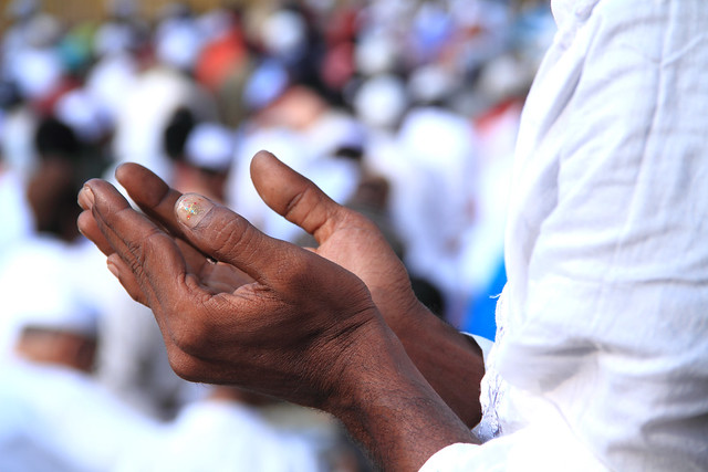 Muslim hands in prayer to Allah