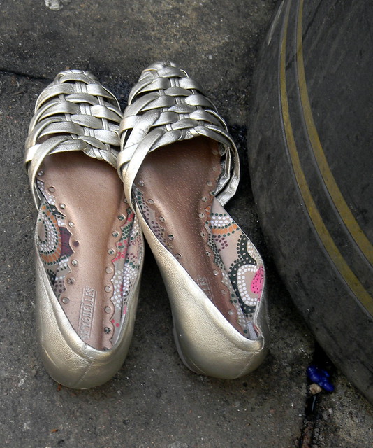 Silver womens shoes Seychelles bin lost dumped abandoned Oxford Street London 29th March 2011 16:34.08pm