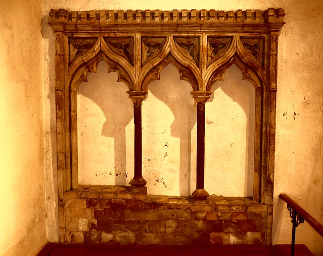 14th century triple ogee-arched sedilia in the north wall of the chancel of St Bartholomew's medieval church, Waltham, Kent, England