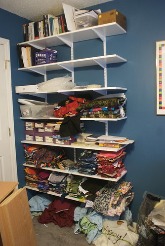 No shelving existed in this room. Added 7 shelves, organized writing supplies, moved Jeff's old computer books to top shelf. Bottom two shelves are temporary storage for fabric until the sewing room is completed.