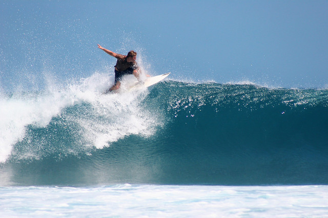 Surfing the waves in Timor, Indonesia.