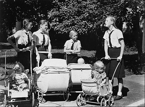 A typical after-school activity for members of the League of German Girls was to take children from large families for an airing in the park while the mothers of the infants were at work