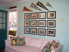 Here's my $50 yard sale sofa--slipcovered with $6 a yard fabric, accessorized with vintage barkcloth pillows I sewed with my own feeble fingers! Those are vintage postcards of my hometown of St. Pete, Fla. above.
