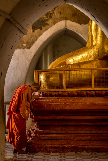 Buddhist monk praying inside a pagoda, Bagan.