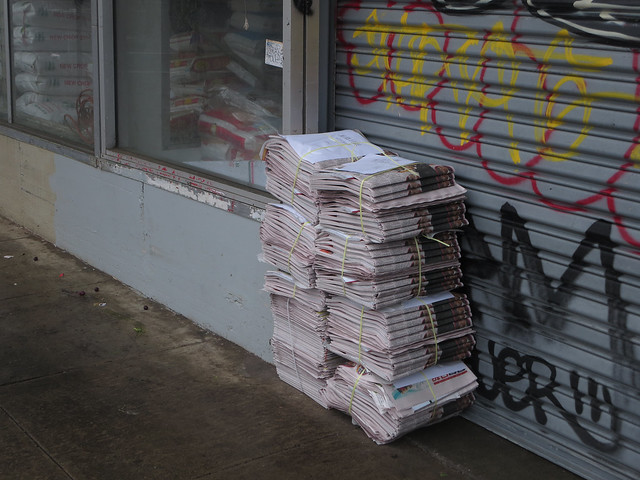 Newspaper stack outside of Sunset Super, early morning (2014)