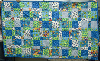 Beth was kind enough to bring in the quilt, almost two years after it was finished, for an 'after' photo and a sewn-in quilt label. Done and done!

I don't think I will do many more disappearing 4-patch quilts. They're lovely and quick, but I feel like there's nothing left to learn where this pattern is concerned.