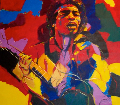 Guitarist singing against bright colour blocks