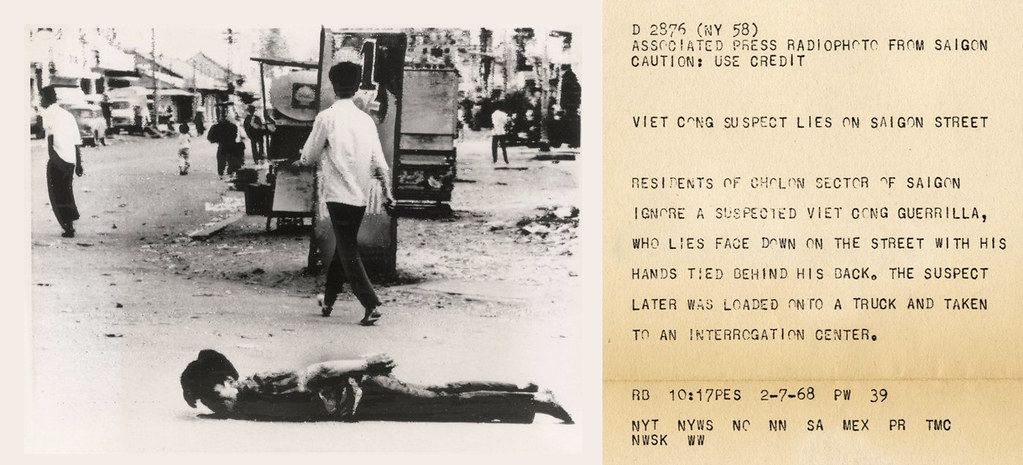 VIETNAM WAR PHOTO - VIET CONG SUSPECT LIES IN SAIGON STREET