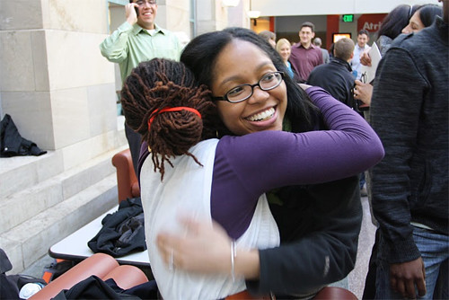 HMS alumna Kristina Mirabeau-beale (right), who practices internal medicine at Brigham and Women's Hospital, celebrates with Stella Safo.