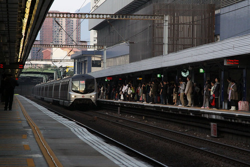 Train arriving into a crowded platform