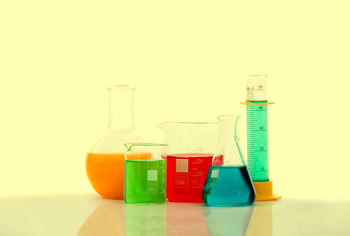 chemistry bottles with liquid inside | by zhouxuan12345678